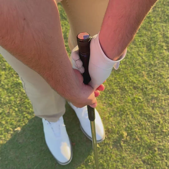 Slow motion golf swing with Grip Topper installed on golf club