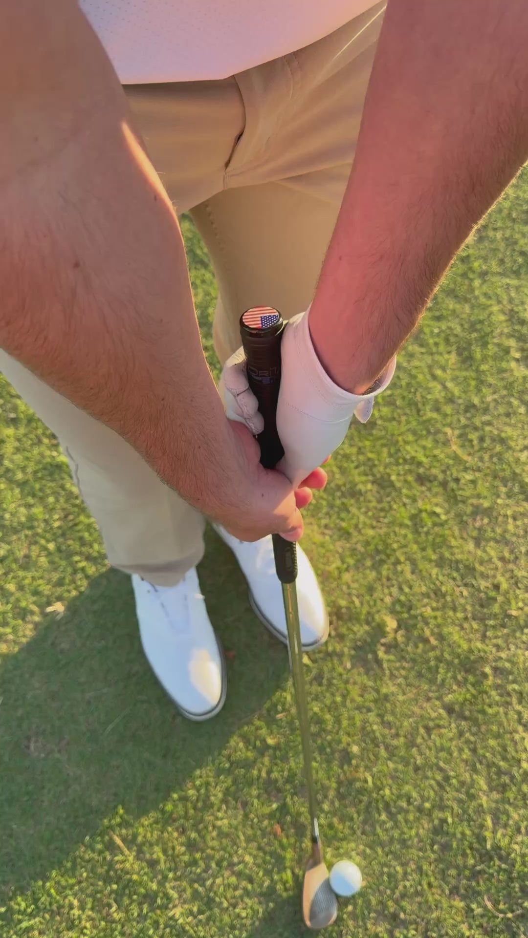 Slow motion golf swing with Grip Topper installed on golf club